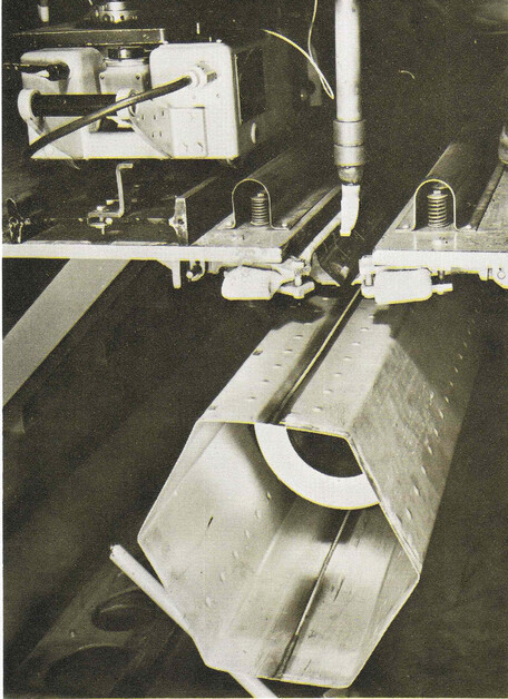 Welding machine welding two halves of a hexagonal SRE fuel assembly together