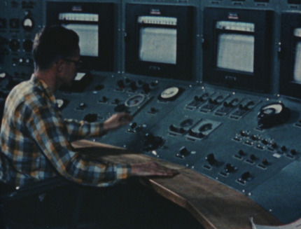 A controller sitting at the HTRE-1 control room